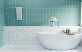 White Bathtub With Green Tile And White Terrazo
